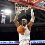 
              Arkansas guard Stanley Umude dunks on a fast break against Central Arkansas during the first half of an NCAA college basketball game Wednesday, Dec. 1, 2021, in Fayetteville, Ark. (AP Photo/Michael Woods)
            