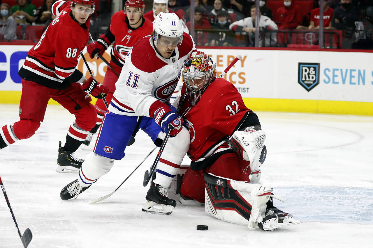 Montreal Canadiens' Brendan Gallagher (11) has his shot blocked by Carolina Hurricanes goaltender A...