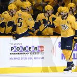 
              Nashville Predators left wing Filip Forsberg (9) is congratulated at the bench after scoring a goal against the Colorado Avalanche during the first period of an NHL hockey game Thursday, Dec. 16, 2021, in Nashville, Tenn. (AP Photo/Mark Zaleski)
            