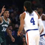 
              Milwaukee Bucks forward Giannis Antetokounmpo (34) reacts after scoring against the New York Knicks during the first half of an NBA basketball game in New York, Sunday, Dec. 12, 2021. (AP Photo/Noah K. Murray)
            