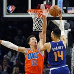 
              Oklahoma City Thunder forward Isaiah Roby (22) defends the basket against Phoenix Suns guard Landry Shamet (14) during the first half of an NBA basketball game Wednesday, Dec. 29, 2021, in Phoenix. (AP Photo/Ross D. Franklin)
            