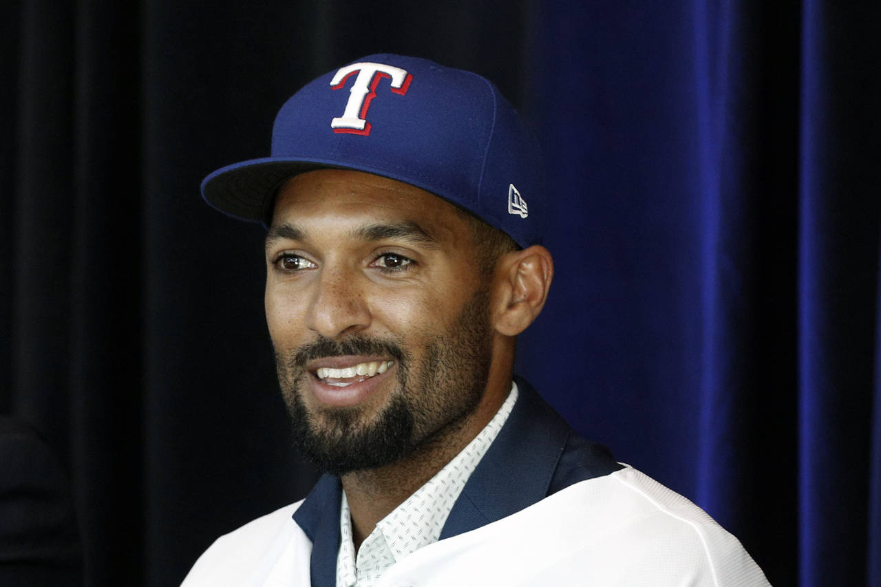 New Texas Rangers infielder Marcus Semien answers questions at a press conference at Globe Life Fie...