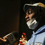 
              Green Run High School cornerback Tayon Holloway is interviewed after signing his national letter of intent for the University of North Carolina during a national signing day event at Green Run High School in Virginia Beach, Va. on Wednesday, Dec. 15, 2021. (Trent Sprague /The Virginian-Pilot via AP)
            