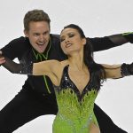 
              FILE - Madison Chock, right, and Evan Bates perform during the rhythm dance program at the Skate America figure skating event Oct. 23, 2021, in Las Vegas. As U.S. skaters, led by three-time world champion Nathan Chen, two-time U.S. champion Alysa Liu, and outstanding ice dance couples Madison Hubbell and Zach Donohue, and Chock and Bates, prepare for nationals during the first week in Jan. 2022, in Nashville, they need to be aware of the pressure ahead. (AP Photo/David Becker, File)
            