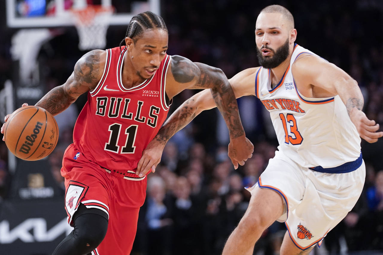 Chicago Bulls forward DeMar DeRozan (11) drives against New York Knicks guard Evan Fournier (13) in...
