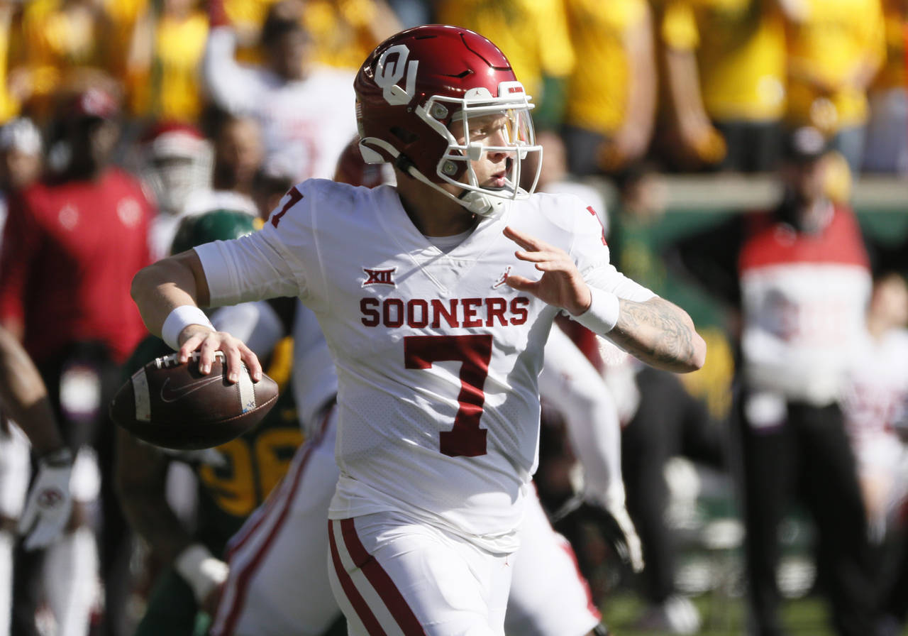 Oklahoma quarterback Spencer Rattler looks to throw down field against Baylor during the second hal...