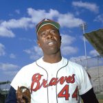 
              FILE - Atlanta Braves' Hank Aaron is seen, March 1967. Aaron made history with one swing of his bat. A year later and on the other side of Georgia, Lee Elder made history with one swing of his driver. Their deaths in 2021 were mourned beyond the sports world and were reminders of the hate, hardships and obstacles they endured with dignity on their way to breaking records and barriers. (AP Photo, File)
            