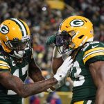 
              Green Bay Packers' Davante Adams congratulates Aaron Jones on his touchdown run during the second half of an NFL football game against the Chicago Bears Sunday, Dec. 12, 2021, in Green Bay, Wis. (AP Photo/Morry Gash)
            