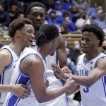 
              Duke guard Trevor Keels, center, celebrates his basket with forward Wendell Moore Jr., left, center Mark Williams, back, and guard Jeremy Roach (3) during the second half of an NCAA college basketball game against South Carolina State, Tuesday, Dec. 14, 2021, in Durham, N.C. (AP Photo/Chris Seward)
            