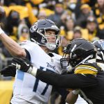 
              Pittsburgh Steelers outside linebacker T.J. Watt (90) hits Tennessee Titans quarterback Ryan Tannehill (17) as he passes during the first half of an NFL football game, Sunday, Dec. 19, 2021, in Pittsburgh. (AP Photo/Don Wright)
            
