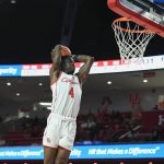 
              Houston guard Taze Moore (4) dunks against Bryant during the first half of an NCAA college basketball game Friday, Dec. 3, 2021, in Houston. (AP Photo/Justin Rex)
            