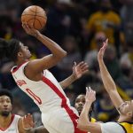 
              Houston Rockets' Jalen Green (0) shoots over Indiana Pacers' Chris Duarte (3) during the second half of an NBA basketball game, Thursday, Dec. 23, 2021, in Indianapolis. (AP Photo/Darron Cummings)
            