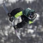 
              Red Gerard, of the United States, executes a trick in the slopestyle finals, Saturday, Dec. 18, 2021, during the Dew Tour snowboarding event at Copper Mountain, Colo. (AP Photo/Hugh Carey)
            