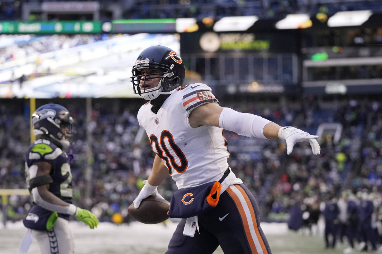 Chicago Bears tight end Jimmy Graham reacts after scoring a touchdown on a pass reception in the en...