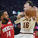 
              Houston Rockets' D.J. Augustin (14) knocks the ball loose from Cleveland Cavaliers' Cedi Osman (16) in the first half of an NBA basketball game, Wednesday, Dec. 15, 2021, in Cleveland. (AP Photo/Tony Dejak)
            