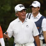 
              Gary Player walks off the first tee box during the first round of the PNC Championship golf tournament Saturday, Dec. 18, 2021, in Orlando, Fla. (AP Photo/Scott Audette)
            