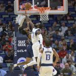 
              New Orleans Pelicans guard Nickeil Alexander-Walker (6) cannot get a shot off at the buzzer against Dallas Mavericks forward Tim Hardaway Jr. (11) in the first half of an NBA basketball game in New Orleans, Wednesday, Dec. 1, 2021. (AP Photo/Matthew Hinton)
            