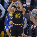
              Golden State Warriors guard Stephen Curry (30) attempts a 3-point basket, which he did not make, during the first half of the team's NBA basketball game against the Portland Trail Blazers in San Francisco, Wednesday, Dec. 8, 2021. (AP Photo/Jeff Chiu)
            