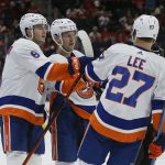 
              New York Islanders right wing Oliver Wahlstrom, center, celebrates his goal against the Detroit Red Wings with defenseman Noah Dobson (8), and left wing Anders Lee (27) during the second period of an NHL hockey game Saturday, Dec. 4, 2021, in Detroit. (AP Photo/Duane Burleson)
            