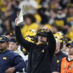 
              Michigan head coach Jim Harbaugh reacts on the sideline during the second half of the Big Ten championship NCAA college football game against Iowa, Saturday, Dec. 4, 2021, in Indianapolis. Michigan won 42-3. (AP Photo/Darron Cummings)
            