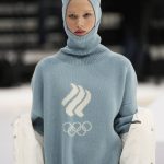
              A model displays the Olympic uniforms for Russian athletes in Moscow, Russia, Friday, Dec. 10, 2021. Russia presents its Olympic kit for the Beijing Winter Olympics 2022, which shouldn't depict any symbols of the country. Russian athletes will compete at the Tokyo Olympics as neutral after the Court of Arbitration for Sport last December banned Russia from using its name, flag and anthem at any world championships because of state-backed doping. (AP Photo/Pavel Golovkin)
            