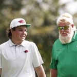 
              John Daly II, left walks off the fourth green with father John Daly during the second round of the PNC Championship golf tournament Sunday, Dec. 19, 2021, in Orlando, Fla. (AP Photo/Scott Audette)
            