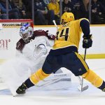 
              Nashville Predators left wing Tanner Jeannot (84) watches a shot by left wing Filip Forsberg get past Colorado Avalanche goaltender Pavel Francouz (39) for a goal during the second period of an NHL hockey game Thursday, Dec. 16, 2021, in Nashville, Tenn. (AP Photo/Mark Zaleski)
            