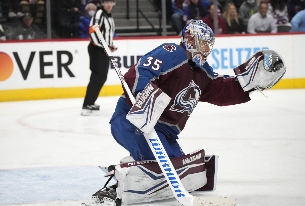 Colorado Avalanche goaltender Darcy Kuemper makes a glove save off a shot from the New York Rangers...