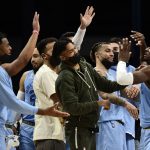 
              Memphis Grizzlies forward Jaren Jackson Jr., right, greets teammates in the first half of an NBA basketball game against the Oklahoma City Thunder, Thursday, Dec. 2, 2021, in Memphis, Tenn. (AP Photo/Brandon Dill)
            
