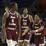 
              Texas Southern forward Joirdon Karl Nicholas (5) celebrates with forward Brison Gresham (44) and guard PJ Henry (3) after playing against Florida during the first half of an NCAA college basketball game Monday, Dec. 6, 2021, in Gainesville, Fla. (AP Photo/Matt Stamey)
            