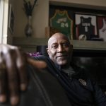 
              Former professional basketball player and Olympic gold medalist Spencer Haywood poses for a photo in front of his basketball memorabilia at his Las Vegas home Monday, Nov. 29, 2021. Haywood, the trailblazing forward who grew up picking cotton in Mississippi and wound up reshaping the league in a way that many take for granted today. (AP Photo/Ellen Schmidt)
            