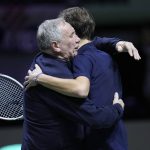 
              Russian Tennis Federation's Daniil Medvedev is embraced by team captain Shamil Tarpishchev as he celebrates after beating Croatia's Marin Cilic to win the Davis Cup tennis final at the Madrid Arena in Madrid, Spain, Sunday, Dec. 5, 2021. (AP Photo/Bernat Armangue)
            