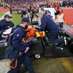 
              Denver Broncos quarterback Teddy Bridgewater is carted off the field after being injured against the Cincinnati Bengals during the second half of an NFL football game, Sunday, Dec. 19, 2021, in Denver. (AP Photo/Jack Dempsey)
            