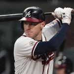 
              FILE - Atlanta Braves first baseman Freddie Freeman (5) bats during a baseball game against the Colorado Rockies on Sept. 15, 2021, in Atlanta. There are 141 major league free agents waiting for a freeze on roster transactions to lift upon the agreement of a new collective bargaining agreement. Carlos Correa, Freddie Freeman and Kris Bryant are among the top players still on the market. (AP Photo/John Bazemore, File)
            