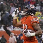 
              Chicago Bears running back David Montgomery celebrates his touchdown during the first half of an NFL football game against the Arizona Cardinals Sunday, Dec. 5, 2021, in Chicago. (AP Photo/David Banks)
            