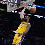 
              Los Angeles Lakers forward LeBron James dunks during the second half of the team's NBA basketball game against the Boston Celtics on Tuesday, Dec. 7, 2021, in Los Angeles. (AP Photo/Marcio Jose Sanchez)
            