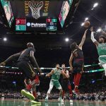 
              Boston Celtics' Marcus Smart goes for a shot over Cleveland Cavaliers' Ricky Rubio during the second quarter of an NBA basketball game Wednesday, Dec. 22, 2021, in Boston. (AP Photo/Winslow Townson)
            