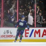 
              Vancouver Canucks' Vasily Podkolzin, of Russia, celebrates his tying goal against the Columbus Blue Jackets during the third period of an NHL hockey game Tuesday, Dec. 14, 2021 in Vancouver, British Columbia. (Darryl Dyck/The Canadian Press via AP)
            