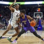 
              James Madison guard Charles Falden (11) stops short of the basket under pressure from Virginia guard Armaan Franklin (4) during the second half of an NCAA college basketball game in Harrisonburg, Va., Tuesday, Dec. 7, 2021.  (Daniel Lin/Daily News-Record via AP)
            