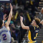 
              Indiana Pacers' Chris Duarte (3) goes up for a dunk against Detroit Pistons' Cade Cunningham (2) during the first half of an NBA basketball game, Thursday, Dec. 16, 2021, in Indianapolis. (AP Photo/Darron Cummings)
            