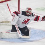 
              New Jersey Devils goaltender Mackenzie Blackwood makes a glove-save during the first period of an NHL hockey game against the Minnesota Wild, Thursday, Dec. 2, 2021, in St. Paul, Minn. (AP Photo/Andy Clayton-King)
            