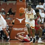 
              Texas guard Andrew Jones (1) moves the ball up court against Incarnate Word after a steal during the second half of an NCAA college basketball game, Tuesday, Dec. 28, 2021, in Austin, Texas. (AP Photo/Eric Gay)
            