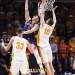 
              Arizona guard Pelle Larsson (3) shoots a reverse layup past Tennessee forward John Fulkerson (10) during an NCAA college basketball game Wednesday, Dec. 22, 2021, in Knoxville, Tenn. (AP Photo/Wade Payne)
            