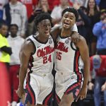 
              Mississippi guard Jarkel Joiner (24) and forward Luis Rodriguez (15) react during the final minutes of an NCAA college basketball game against Memphis in Oxford, Miss., Saturday, Dec. 4, 2021. Mississippi won 67-63. (AP Photo/Thomas Graning)
            