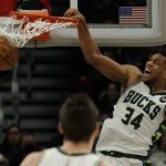 
              Milwaukee Bucks' Giannis Antetokounmpo dunks during the first half of an NBA basketball game against the Charlotte Hornets Wednesday, Dec. 1, 2021, in Milwaukee. (AP Photo/Morry Gash)
            