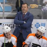 
              Philadelphia Flyers head coach Alain Vigneault stands behind his bench during the first period of an NHL hockey game against the Pittsburgh Penguins in Pittsburgh, Thursday, Nov. 4, 2021. The Flyers have fired coach Alain Vigneault following eight straight losses, two shy of matching a team record of 10 in a row, a person with knowledge of the situation told The Associated Press on Monday, Dec. 6, 2021. (AP Photo/Gene J. Puskar)
            