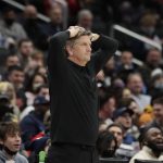 
              Minnesota Timberwolves coach Chris Finch waches during the first half of the team's NBA basketball game against the Washington Wizards, Wednesday, Dec. 1, 2021, in Washington. (AP Photo/Luis M. Alvarez)
            