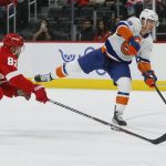 
              New York Islanders left wing Anthony Beauvillier (18) takes a shot on goal against Detroit Red Wings defenseman Jordan Oesterle (82) during the second period of an NHL hockey game Saturday, Dec. 4, 2021, in Detroit. (AP Photo/Duane Burleson)
            