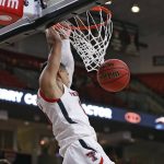 
              Texas Tech's Kevin McCullar (15) dunks the ball during the first half of an NCAA college basketball game against Eastern Washington on Wednesday, Dec. 22, 2021, in Lubbock, Texas. (AP Photo/Brad Tollefson)
            