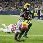 
              Green Bay Packers' Davante Adams catches a touchdown pass in front of Cleveland Browns' M.J. Stewart during the first half of an NFL football game Saturday, Dec. 25, 2021, in Green Bay, Wis. (AP Photo/Matt Ludtke)
            